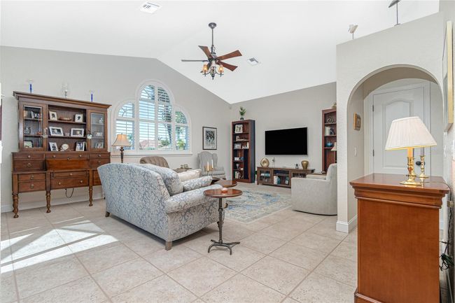 Separate family room is perfect for entertaining family and friends - cathedral ceilings | Image 30