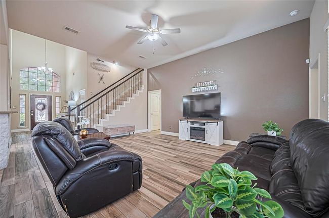 The prominent accent wall is perfectly sized to host your media setup, making it a central feature of the living space. | Image 19