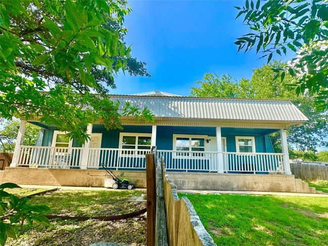 View of front of property featuring covered porch and a metal roof | Image 4