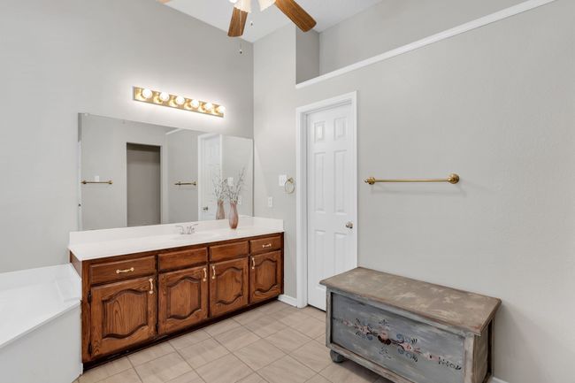 Primary Bathroom featuring vanity, and a towering ceiling | Image 24