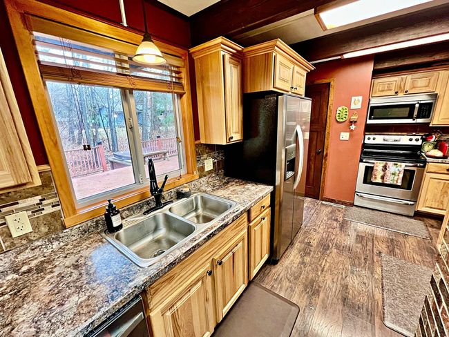 Kitchen counters and SS appliance and bright windows.jpg | Image 6