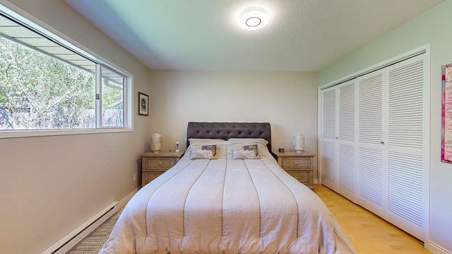 Bedroom featuring wood finished floors | Image 12