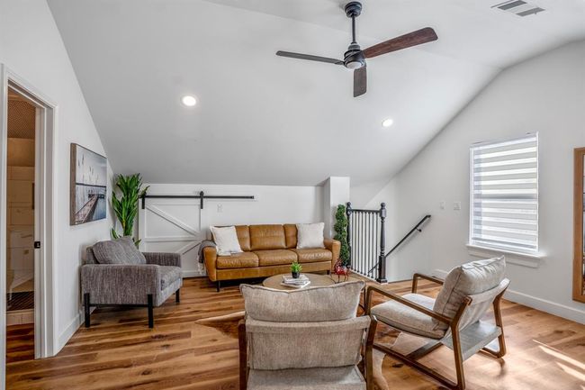 Another view of the upstairs loft—offering inviting space to relax, gather, or create a private retreat within the other building. | Image 31