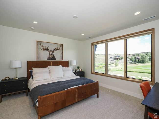 Bedroom with light carpet and recessed lighting | Image 75