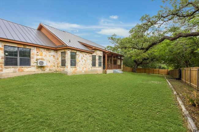The view of the house from the back left corner of the fenced portion of the back yard. | Image 30