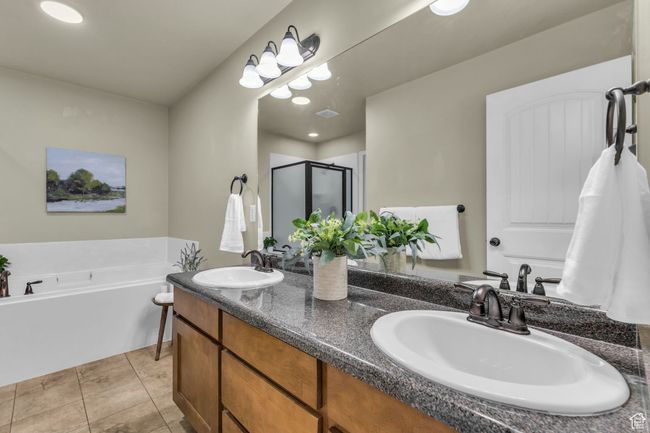 Full bath with a bath, a shower stall, double vanity, and a sink | Image 6