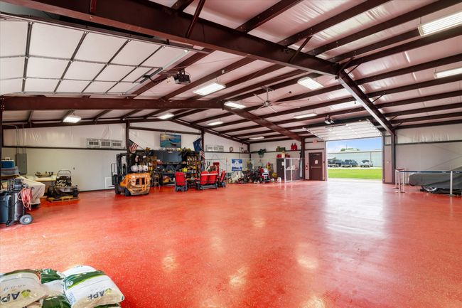 Garage with a ceiling fan | Image 6