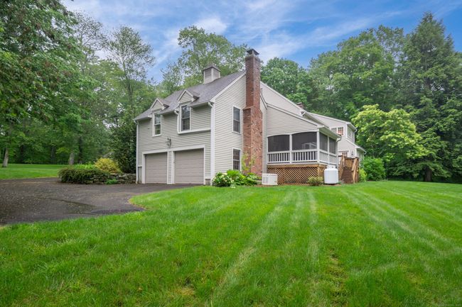 Side view of home showing 2nd driveway in addition to circular out front and Cupola with expansive yard | Image 5