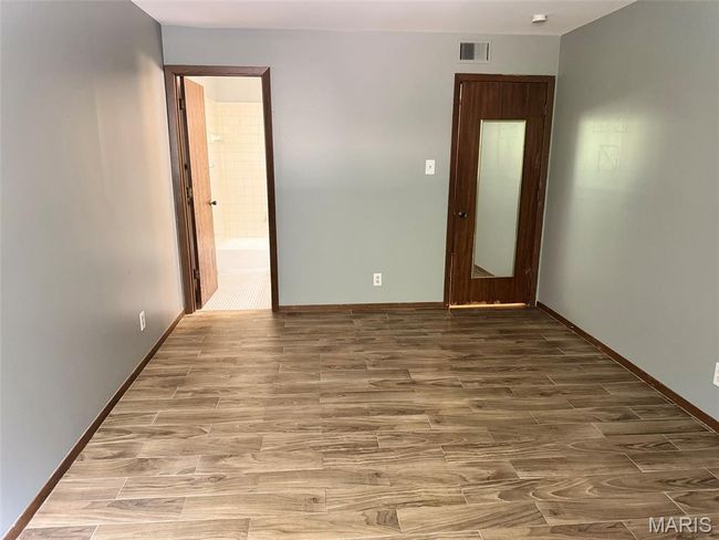 Spare room with wood finished floors | Image 17
