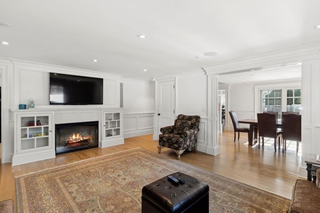 Living room with ornamental molding and light hardwood / wood-style flooring | Image 17