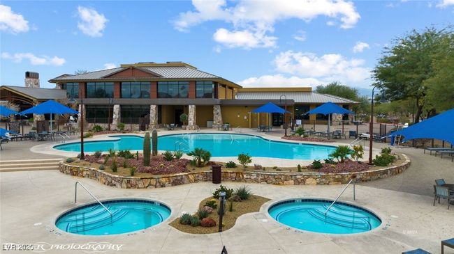 Pool featuring a patio, fence, and a hot tub | Image 71