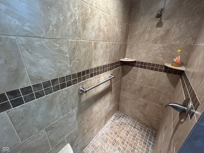 full bathroom with tiled shower | Image 15
