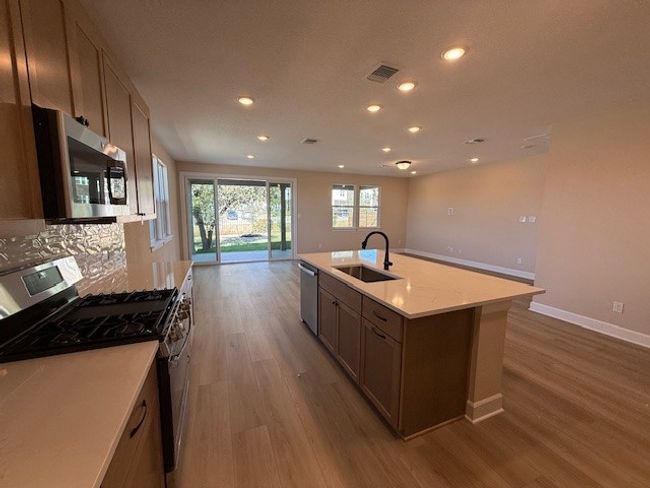 Open Concept Kitchen with stainless steel appliances | Image 5