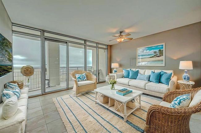 Spacious open floorplan with a large den, featuring easy-care tile flooring and stylish decor accents. (AI photo) | Image 8