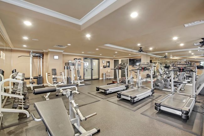 The fully equipped fitness center is open 24/7, offering residents round-the-clock access to a wide range of well-maintained cardio machines and weight training equipment—making it easy to stay active and energized on your schedule. | Image 35