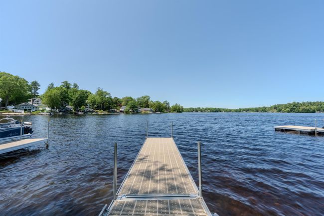 This development was once a Campground. Now 22 families enjoy their very own private beach. Kayak racks onsite. | Image 57