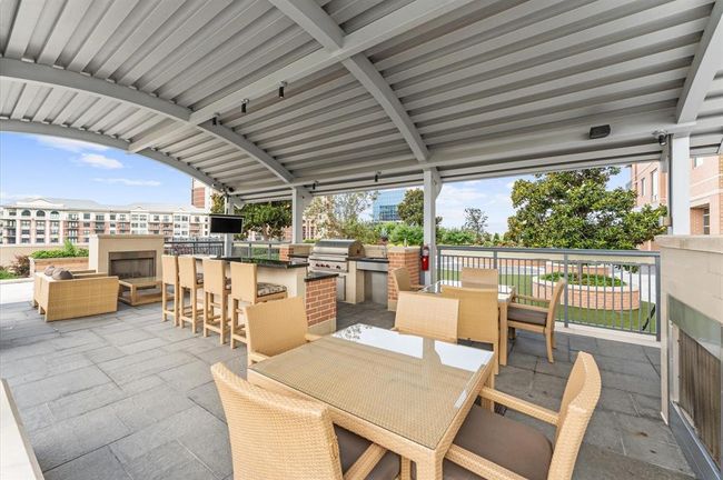 The cabana has two fire places , tv, refrigerator and grill. | Image 29