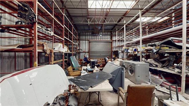 Garage with independent washer and dryer and metal wall | Image 35