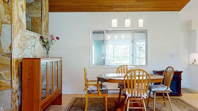Dining space with vaulted wooden ceiling | Image 8