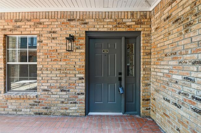 Property entrance with brick siding | Image 24