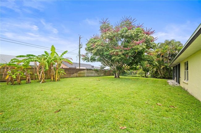 View of fenced backyard | Image 31