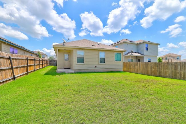 Back of property with a fenced backyard | Image 33