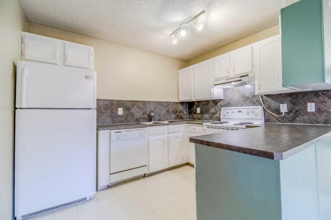 63 Heath Close, Home with 3 bedrooms, 2 bathrooms and 2 parking in Red Deer AB | Image 4