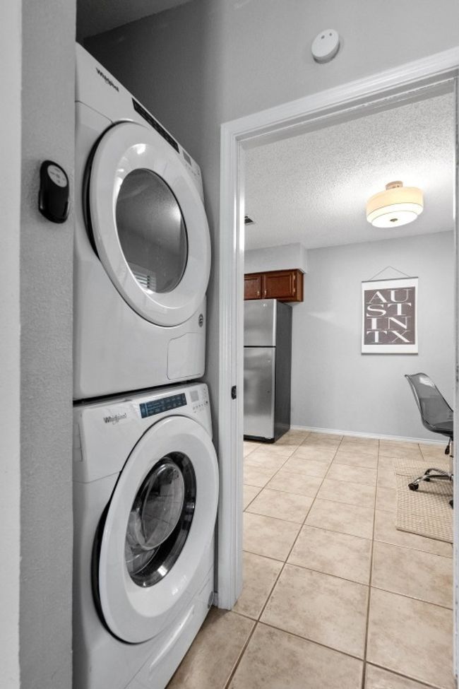 Laundry area with stacked washer / dryer at entry to bonus room | Image 25