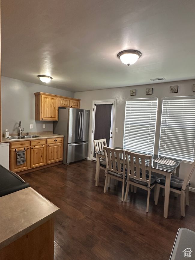 Dining area with visible vents and dark wood-type flooring | Image 8