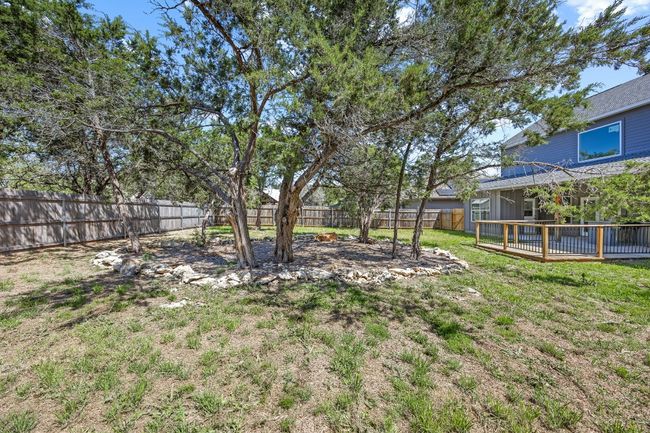 View of yard with a fenced backyard and a wooden deck | Image 26