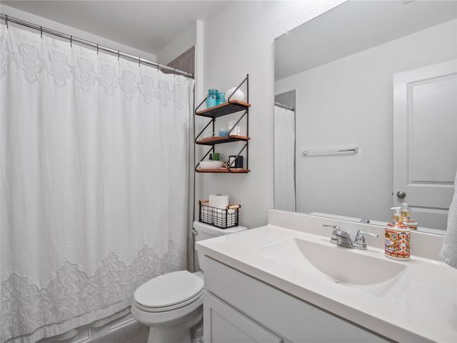 Full bathroom featuring vanity, and a shower tub combo. | Image 14