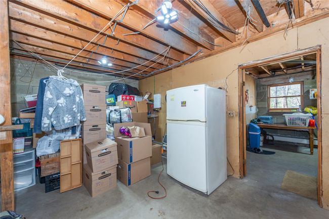 Basement with freestanding refrigerator | Image 41