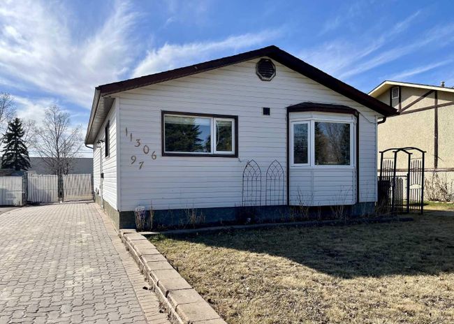 11306 97 Street, Home with 4 bedrooms, 2 bathrooms and 2 parking in Grande Prairie AB | Image 1