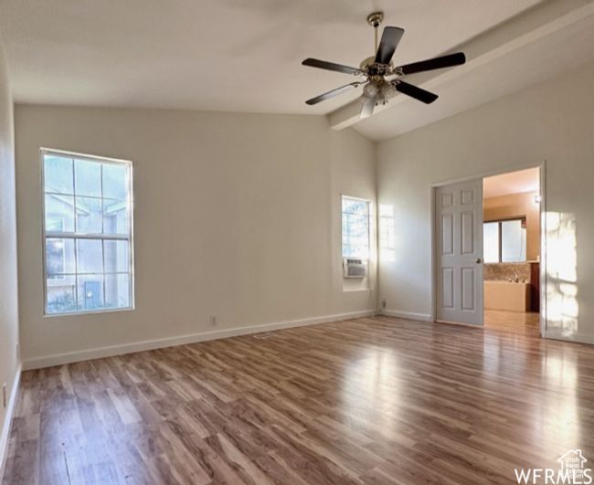 Unfurnished room with baseboards, wood finished floors, a ceiling fan, and plenty of natural light | Image 5