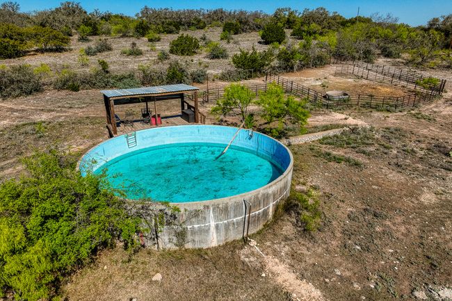 View of swimming pool featuring fence | Image 19