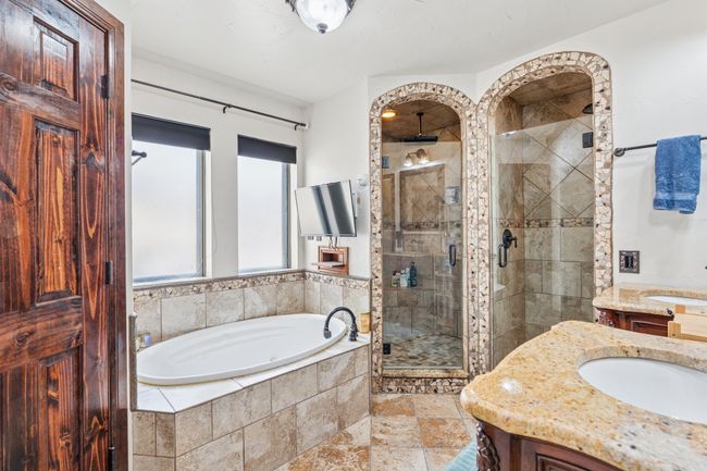 Amazing Ensuite Bath with walk-in closet, jetted tub, 2 separate showers with multiple sprays & 2 separate vanities! | Image 17