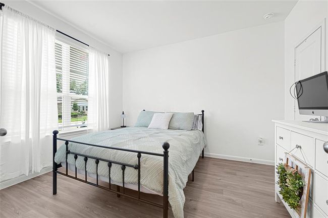 Dedicated study offers privacy and flexibility for work-from-home or creative space; can also be used, as pictured here, as an extra bedroom for family or guests. | Image 13