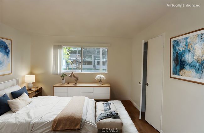 Primary Bedroom - Virtually staged with REimagineHome - All furniture, throw rug, plants, and art on the wall was added virtually. | Image 11