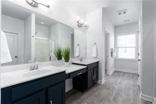 Primary Bathroom with Soaking Tub, Dual Vanity, Separate Commode, and Linen Closet | Image 15