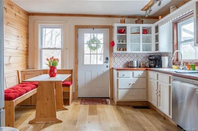 Whip up a meal in this fully equipped kitchen. The kitchen has a coffee maker, fridge, stove, oven, microwave, toaster, and toaster oven. | Image 2