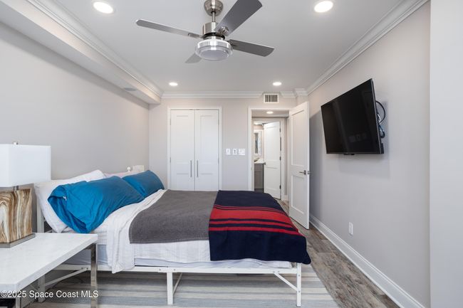 Beautifully done, with tv mounted and closet organizers already installed. | Image 32