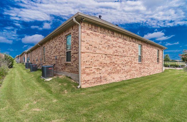View of side of property with brick siding and a yard | Image 21