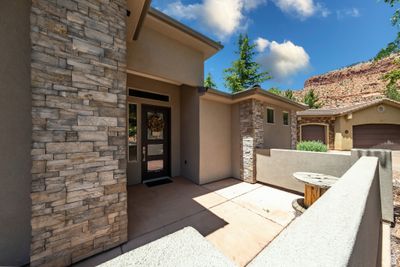 Entrance to property with a garage | Image 2