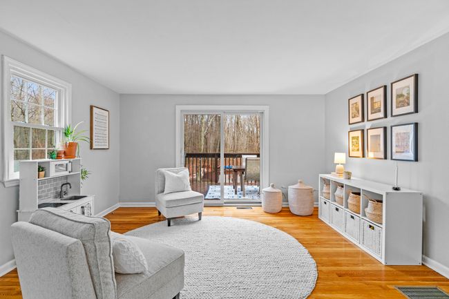 Bright family room with sliders out to the back deck | Image 12