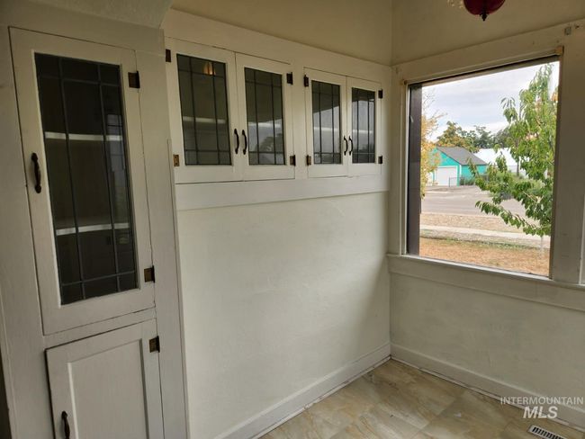 View of unfurnished sunroom | Image 7
