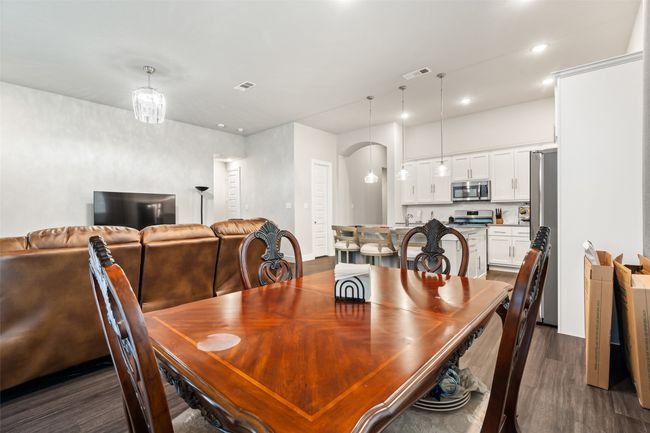 Dining space with dark hardwood / wood-style flooring | Image 7