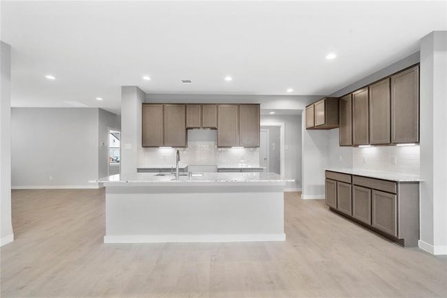 This photo is for illustrative purposes only and is not to be considered an exact replica of the finished home. Rendering does not match the finished product in terms of features, colors, landscaping, etc. Pricing, specifications, square footage and materials are subject to change at any time and without notice. | Image 5