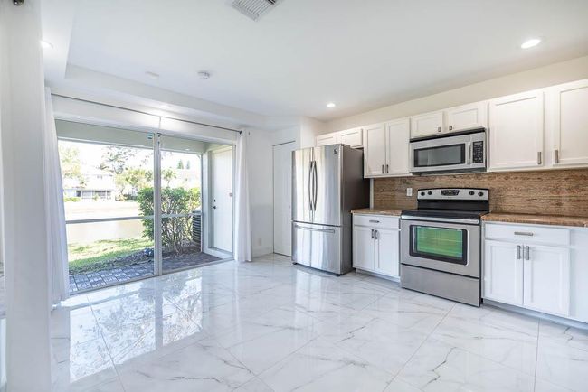 6408 Sandy Bank Ter, Condo with 3 bedrooms, 3 bathrooms and null parking in Riviera Beach FL | Image 28