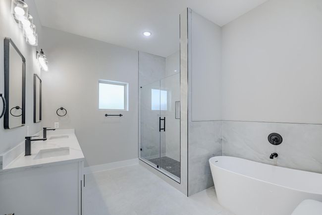 Primary bath with dual sinks, soaking tub, and walk-in shower | Image 24