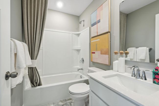 *Photo of model home, actual features may vary. The spacious main level bath provides plenty of space for everyone to get ready during those busy mornings. | Image 14